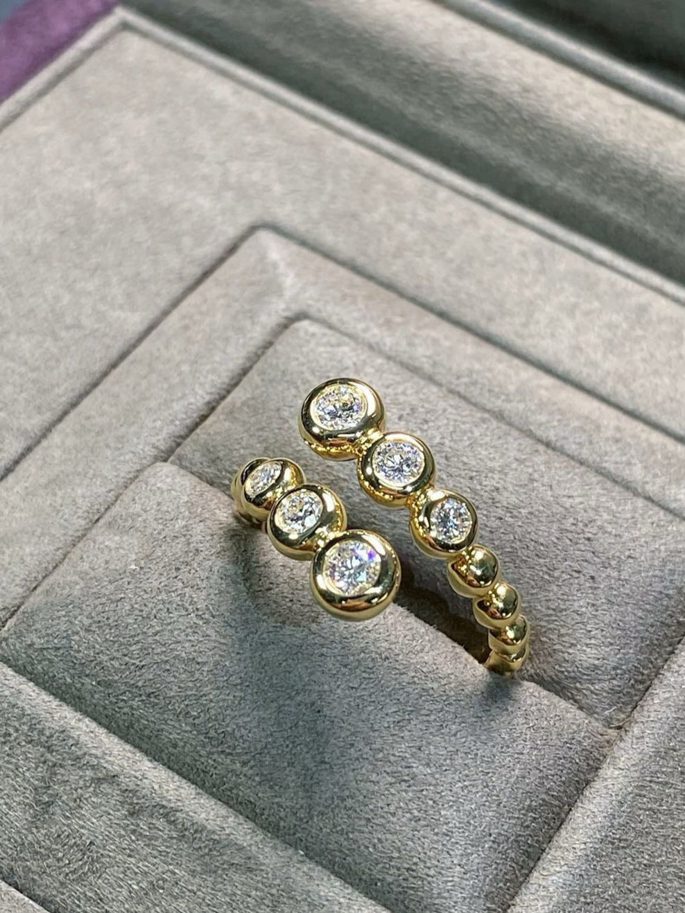 Graduated Bezel Diamond Ring