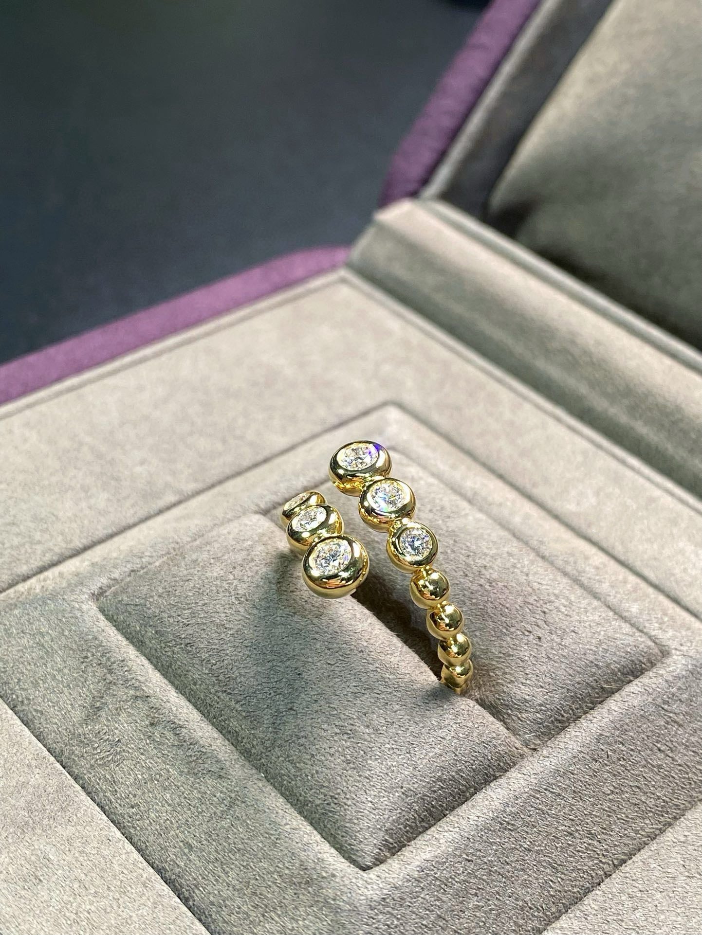 Graduated Bezel Diamond Ring
