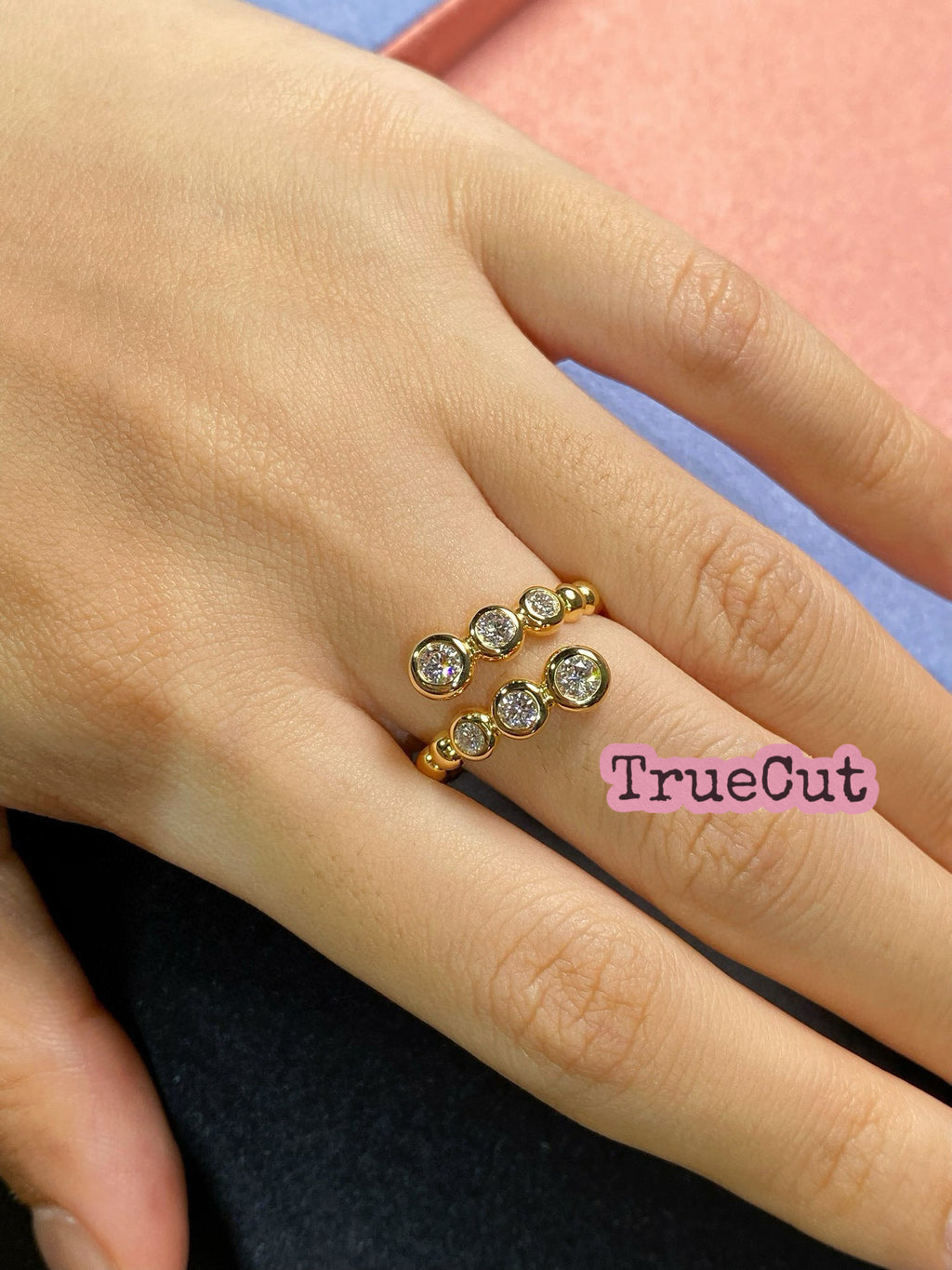 Graduated Bezel Diamond Ring